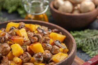 Side View Dish Oil Branches Brown Bowl Potatoes With Mushrooms Cutting Board Fork Oil Bowl White Mushrooms Spruce Branches 1